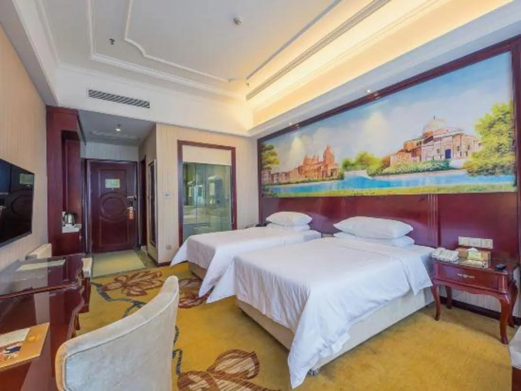 Bed in Vienna Hotel Jiangxi Ji'an Anfu