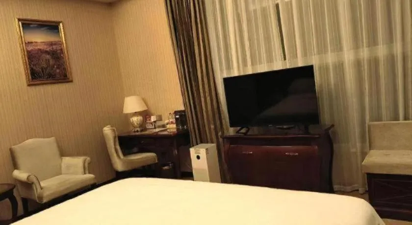 Bed in Vienna Hotel Jiangxi Ji'an Anfu