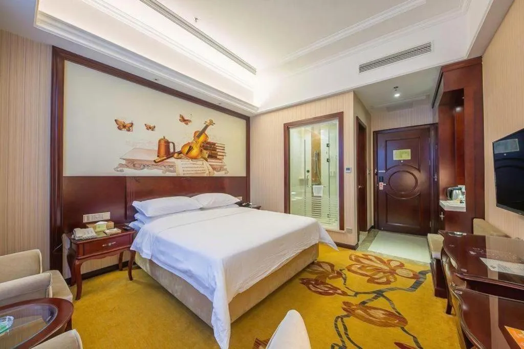 Bed in Vienna Hotel Jiangxi Ji'an Anfu