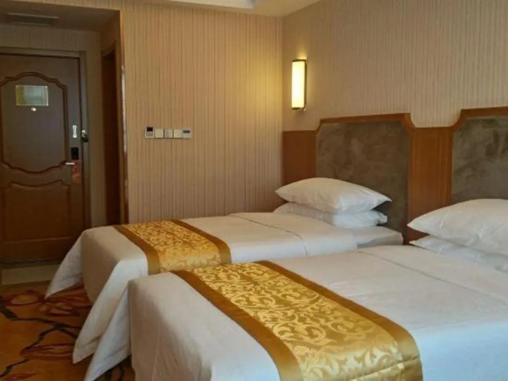 Bed in Vienna Hotel Jiangxi Ji'an Anfu