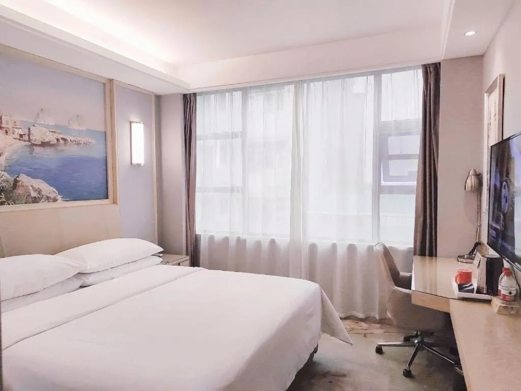 Bed in Vienna Hotel Guangxi Hechi Jinchengjiang Baima Street