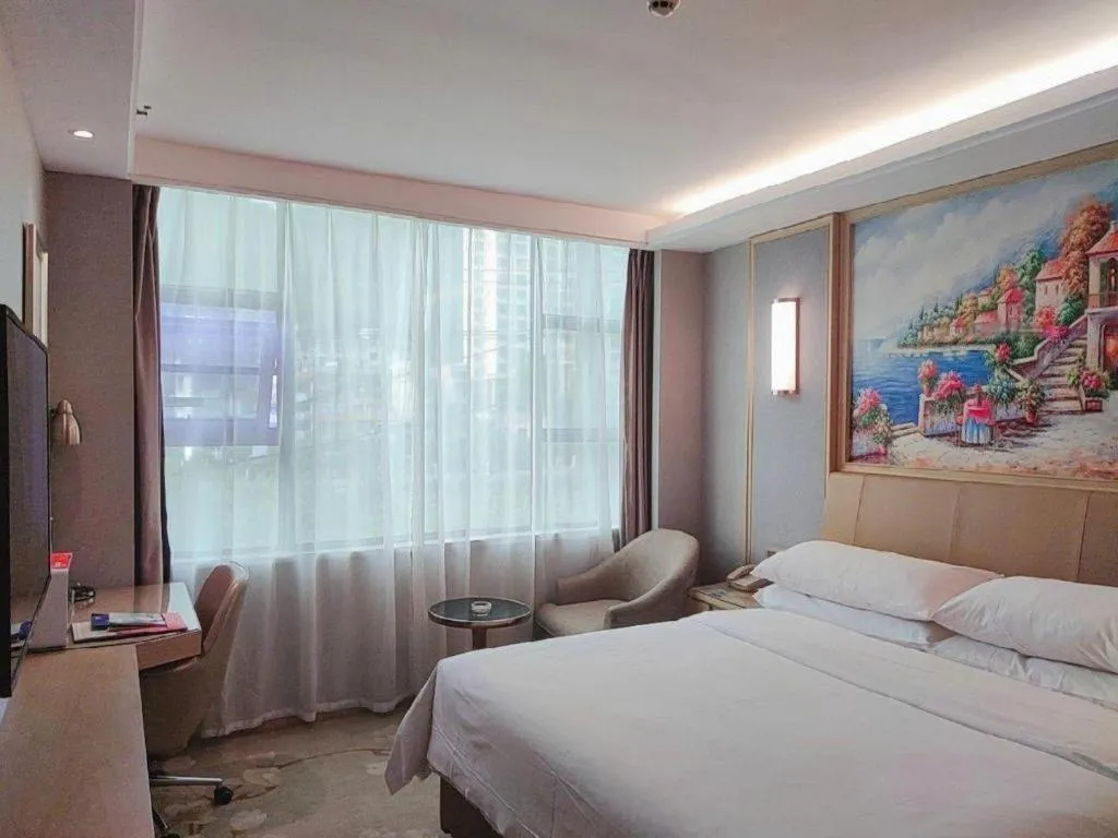 Bed in Vienna Hotel Guangxi Hechi Jinchengjiang Baima Street