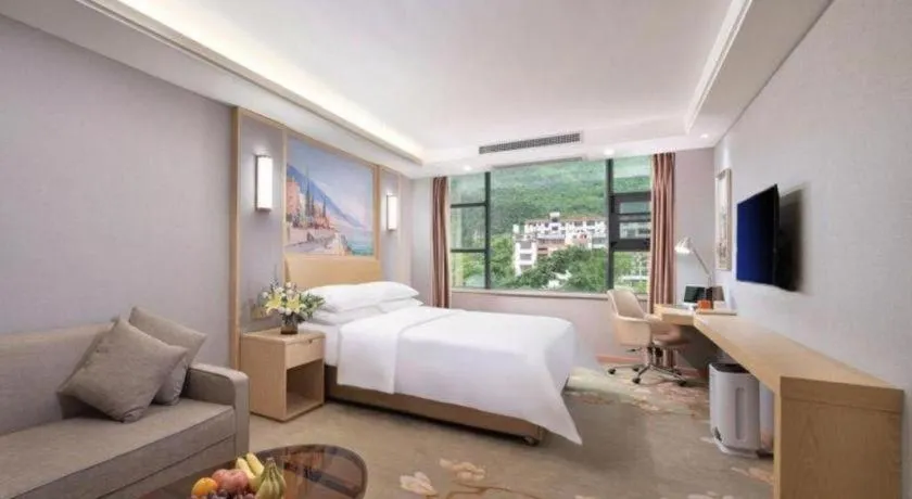 Bed in Vienna Hotel Guangxi Hechi Jinchengjiang Baima Street