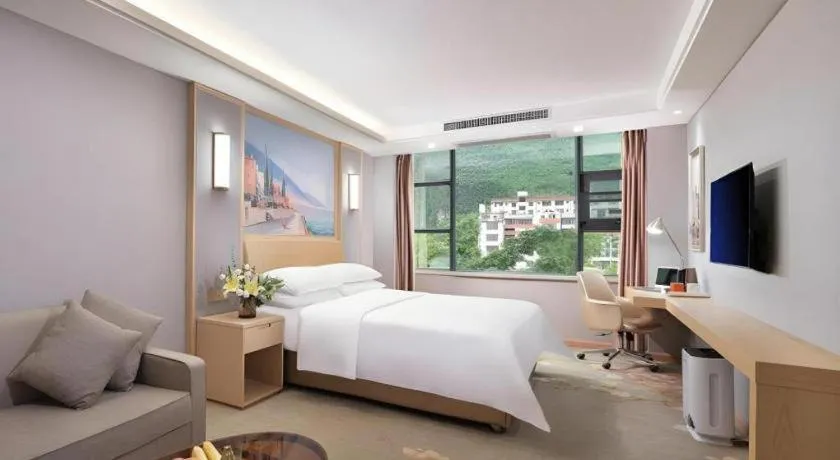 Bed in Vienna Hotel Guangxi Hechi Jinchengjiang Baima Street