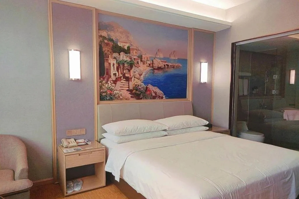 Bed in Vienna Hotel Guangxi Hechi Jinchengjiang Baima Street