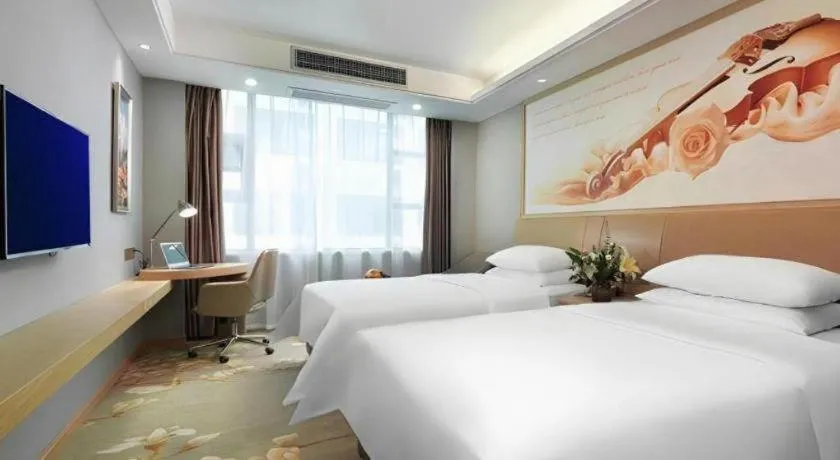 Bed in Vienna Hotel Guangxi Hechi Jinchengjiang Baima Street