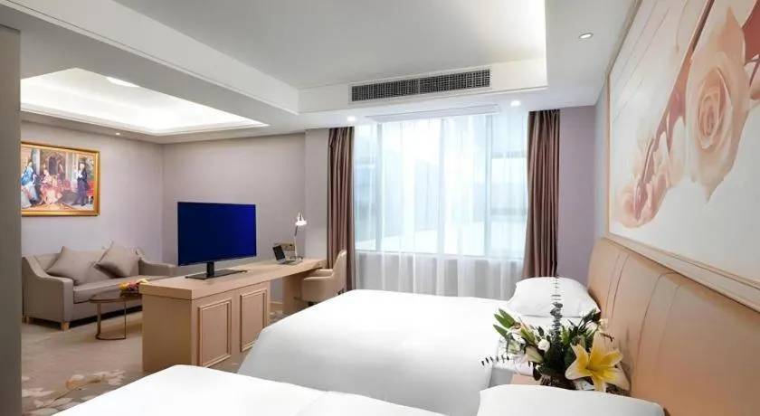 Bed in Vienna Hotel Guangxi Hechi Jinchengjiang Baima Street