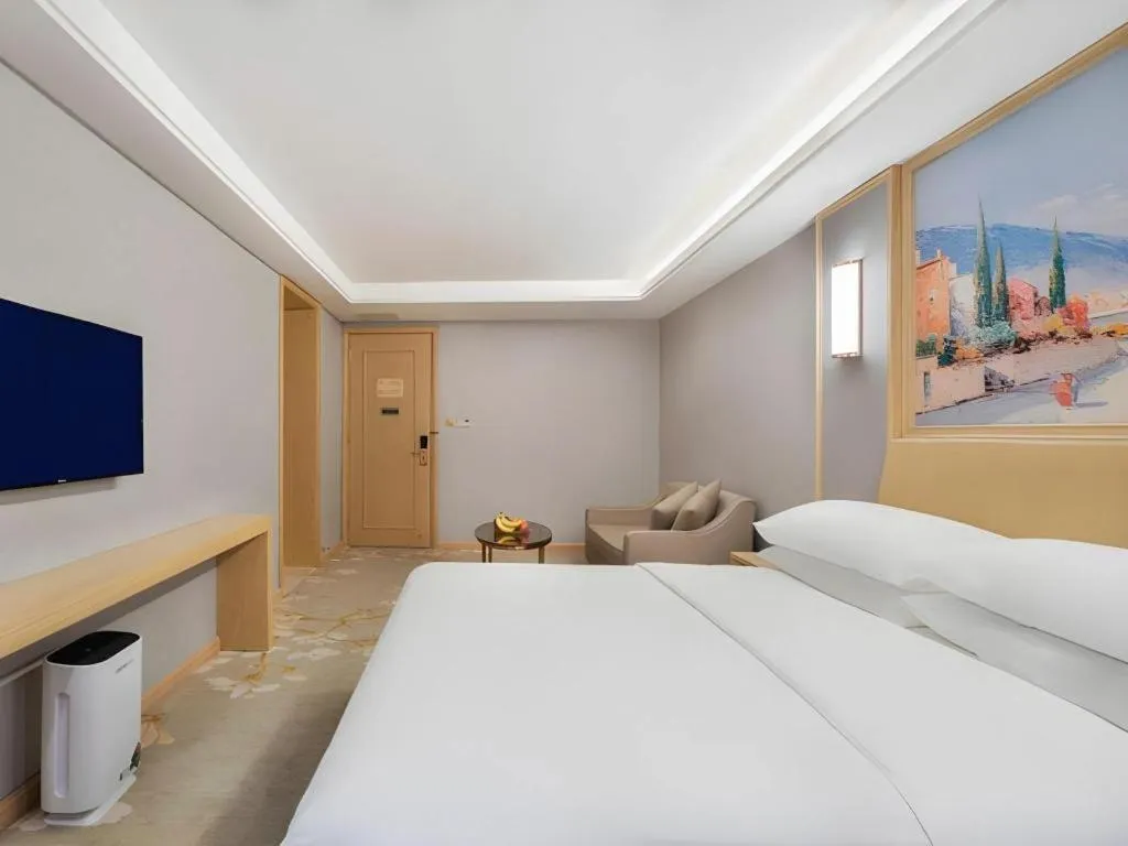 Bed in Vienna Hotel Guangxi Hechi Jinchengjiang Baima Street