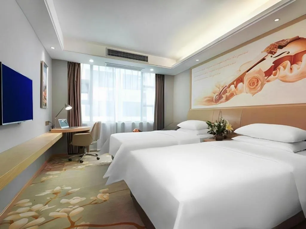 Bed in Vienna Hotel Guangxi Hechi Jinchengjiang Baima Street