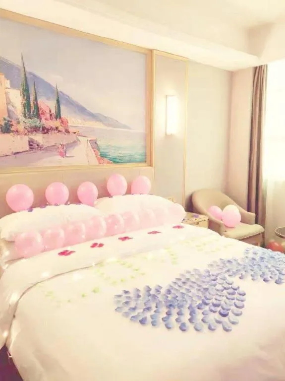 Bed in Vienna Hotel Guangxi Hechi Jinchengjiang Baima Street