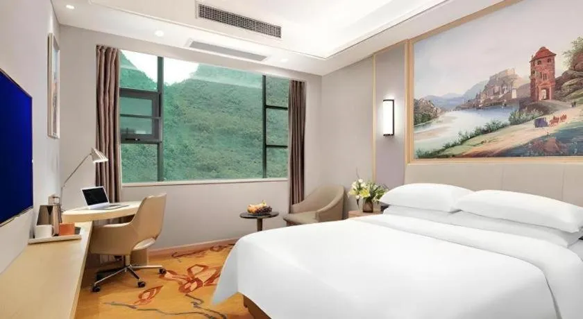 Bed in Vienna Hotel Guangxi Hechi Jinchengjiang Baima Street