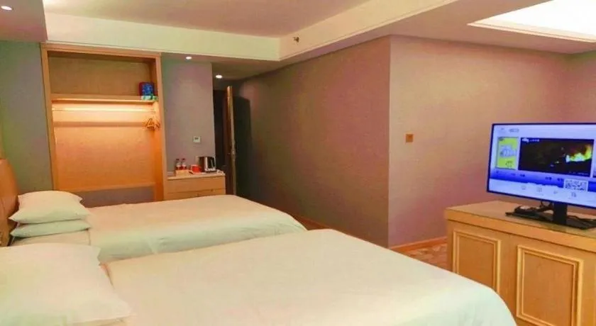 Bed in Vienna Hotel Guangxi Hechi Jinchengjiang Baima Street