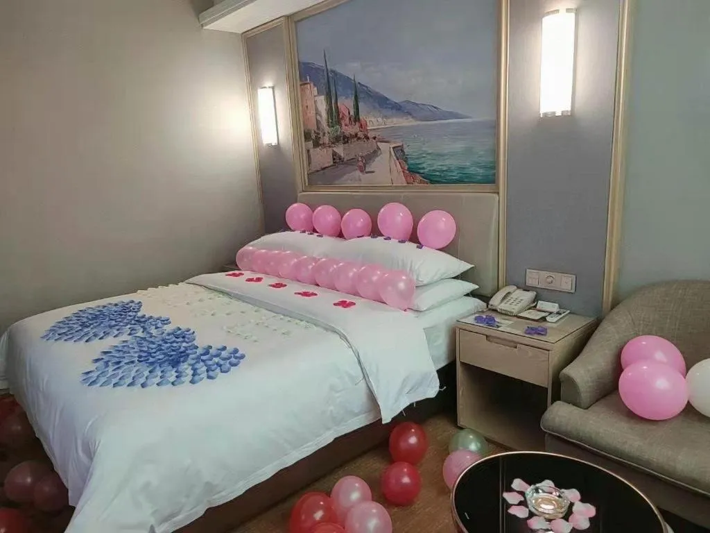 Bed in Vienna Hotel Guangxi Hechi Jinchengjiang Baima Street