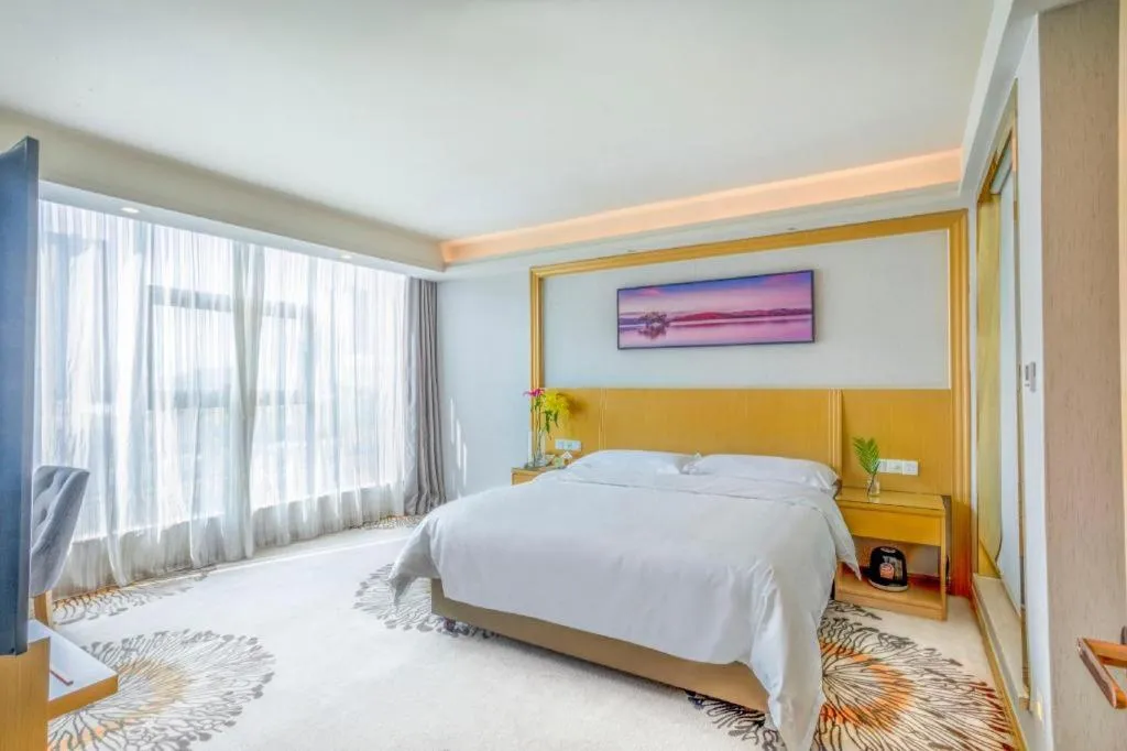Bed in Vienna Hotel Guangzhou Huadu Financial Center Sunac Amusement Park