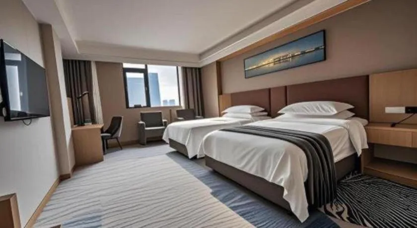 Bed in Vienna Hotel Guangzhou Huadu Financial Center Sunac Amusement Park