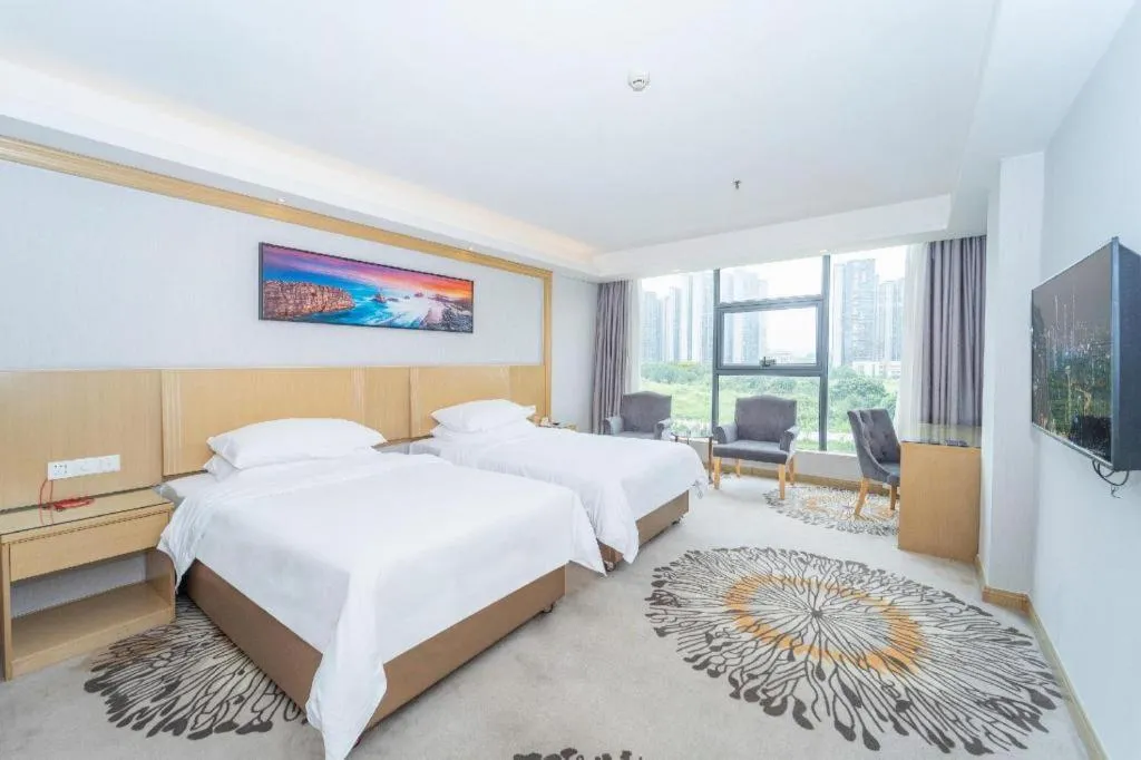 Bed in Vienna Hotel Guangzhou Huadu Financial Center Sunac Amusement Park