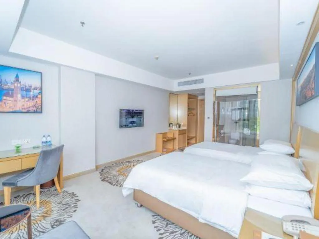 Bed in Vienna Hotel Guangzhou Huadu Financial Center Sunac Amusement Park