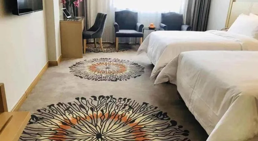 Bed in Vienna Hotel Guangzhou Huadu Financial Center Sunac Amusement Park