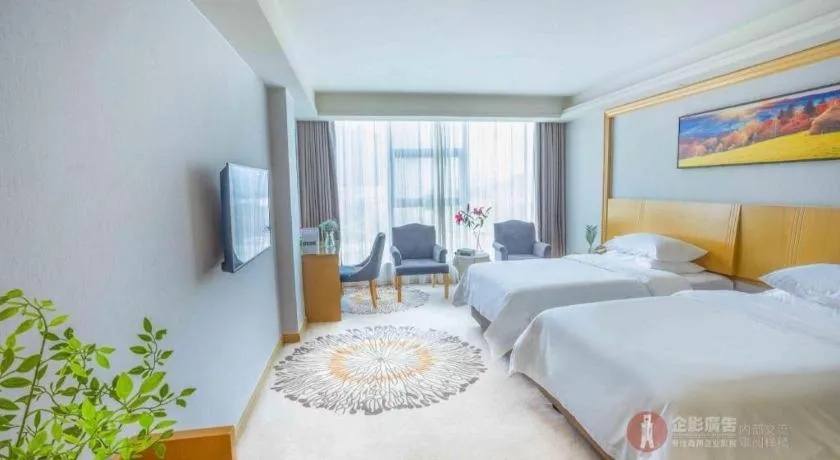 Bed in Vienna Hotel Guangzhou Huadu Financial Center Sunac Amusement Park