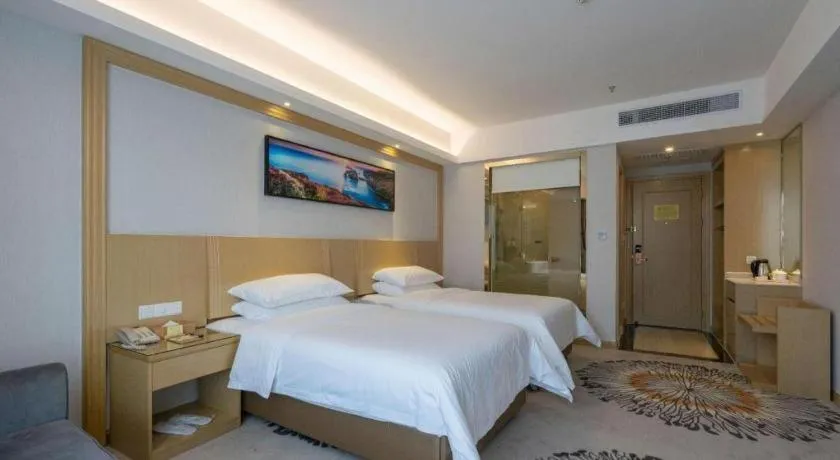 Bed in Vienna Hotel Guangzhou Huadu Financial Center Sunac Amusement Park