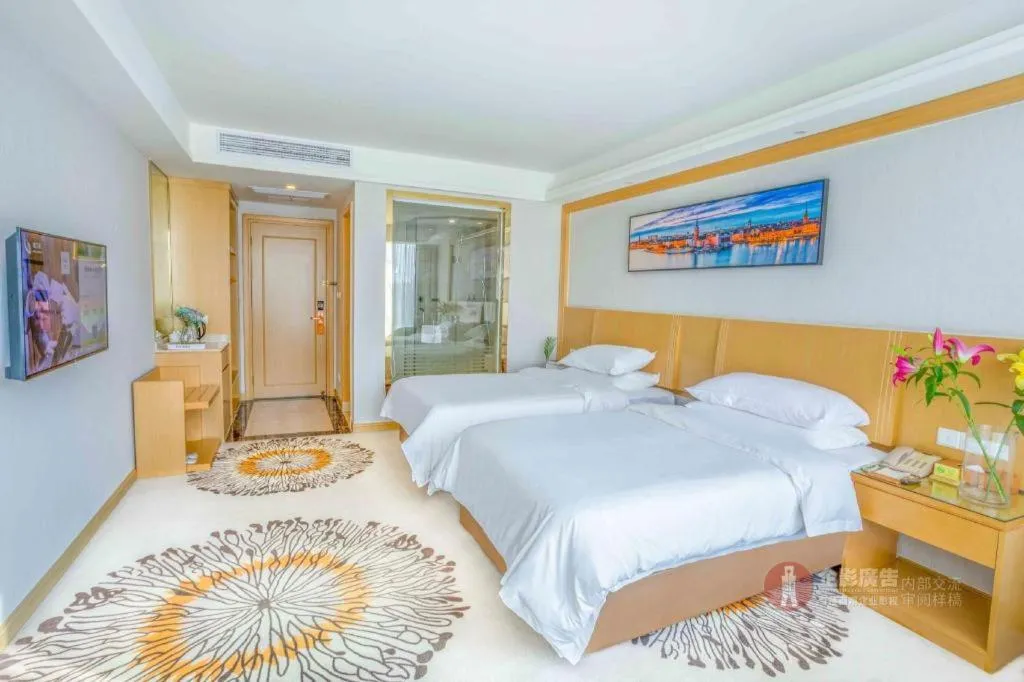Bed in Vienna Hotel Guangzhou Huadu Financial Center Sunac Amusement Park