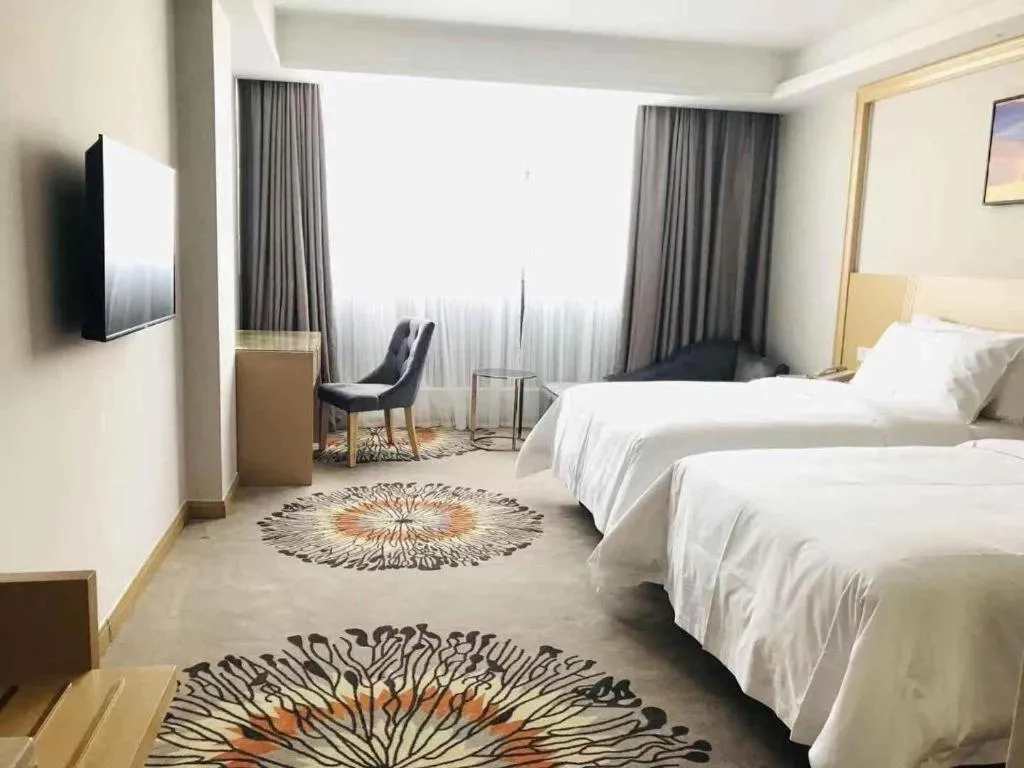 Bed in Vienna Hotel Guangzhou Huadu Financial Center Sunac Amusement Park