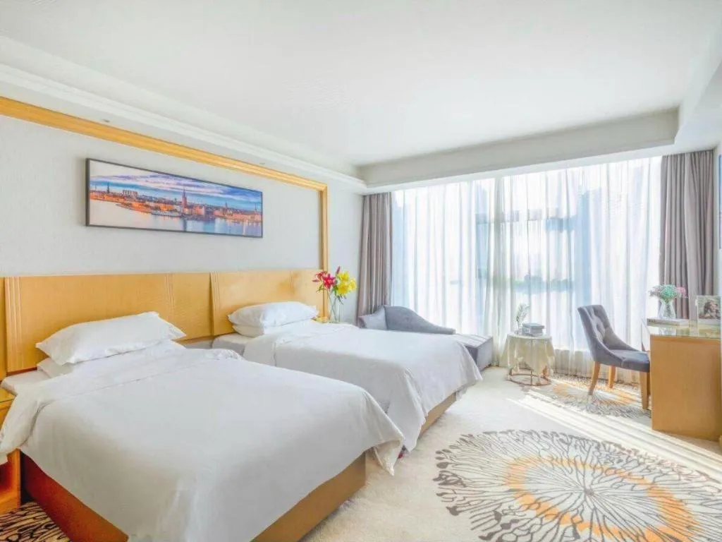 Bed in Vienna Hotel Guangzhou Huadu Financial Center Sunac Amusement Park