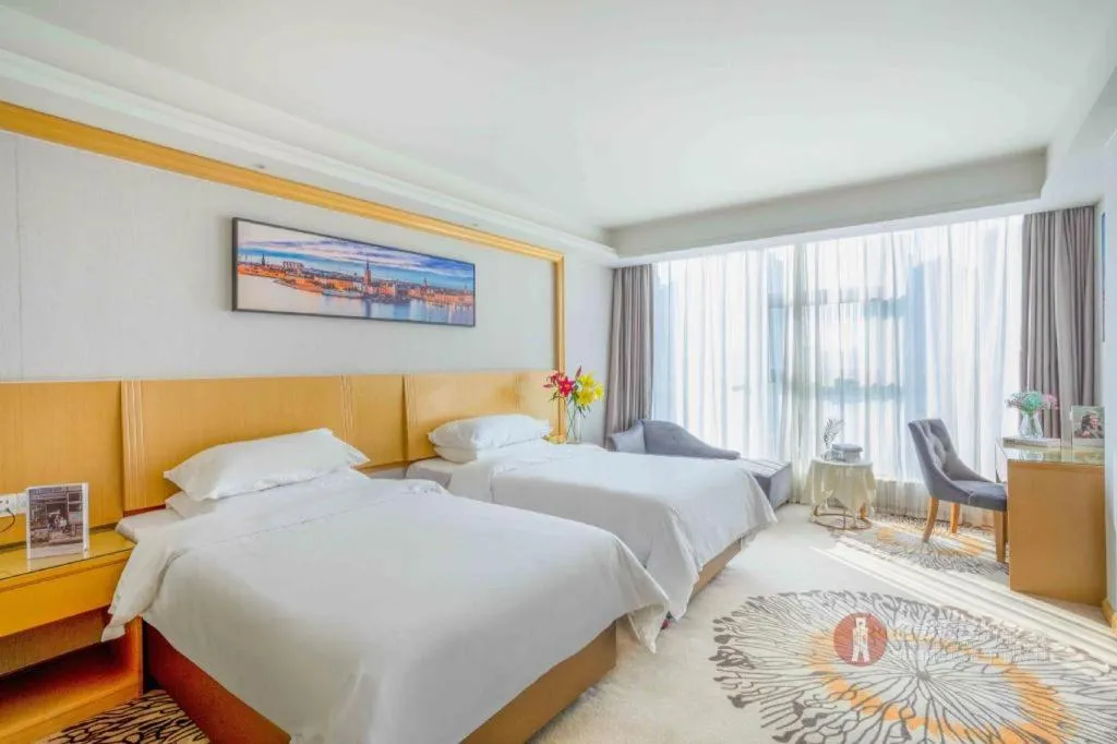 Bed in Vienna Hotel Guangzhou Huadu Financial Center Sunac Amusement Park