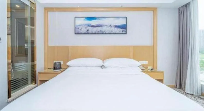 Bed in Vienna Hotel Guangzhou Huadu Financial Center Sunac Amusement Park