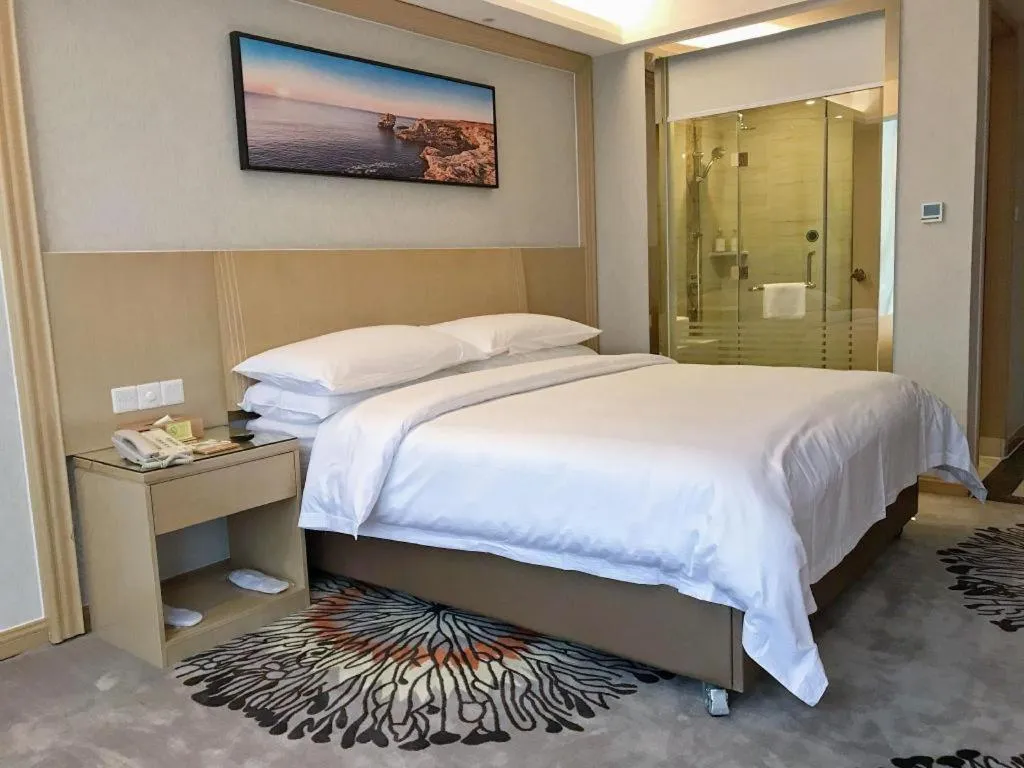 Bed in Vienna Hotel Guangzhou Huadu Financial Center Sunac Amusement Park