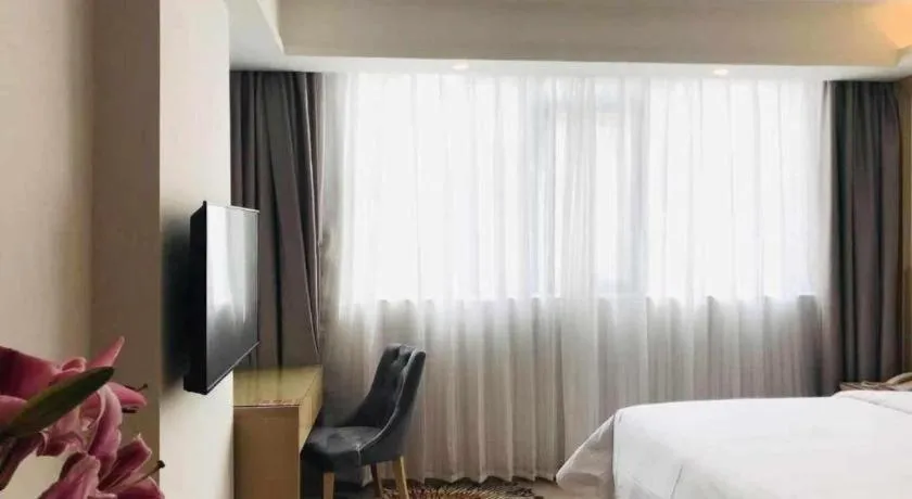 Bed in Vienna Hotel Guangzhou Huadu Financial Center Sunac Amusement Park