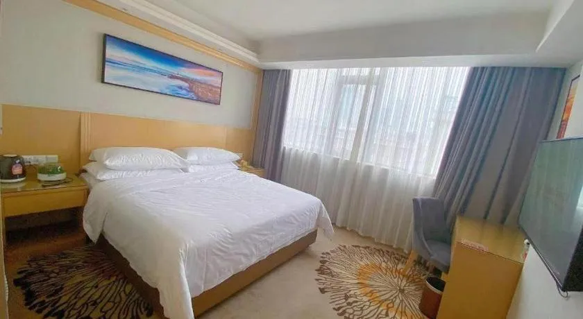 Bed in Vienna Hotel Guangzhou Huadu Financial Center Sunac Amusement Park