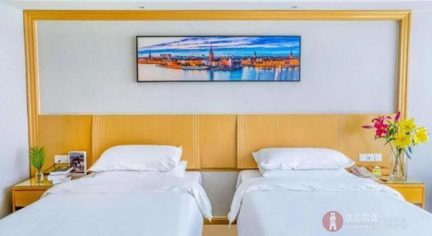 Bed in Vienna Hotel Guangzhou Huadu Financial Center Sunac Amusement Park