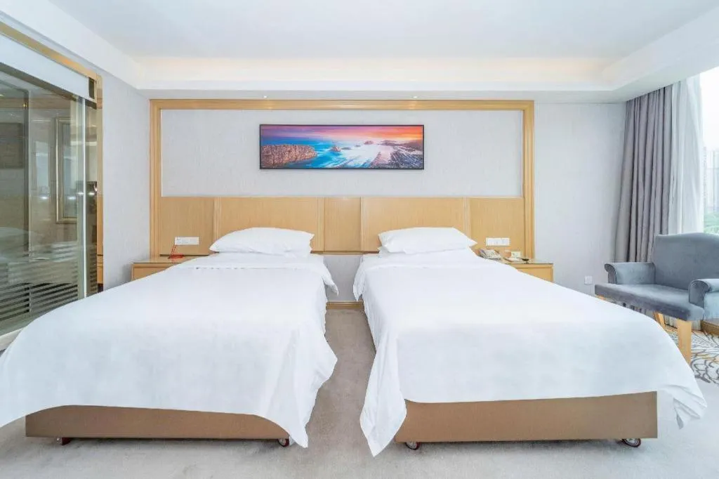 Bed in Vienna Hotel Guangzhou Huadu Financial Center Sunac Amusement Park