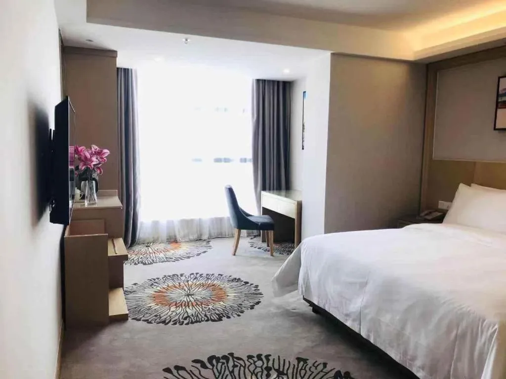 Bed in Vienna Hotel Guangzhou Huadu Financial Center Sunac Amusement Park
