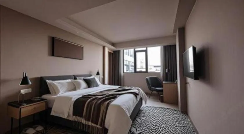 Bed in Vienna Hotel Guangzhou Huadu Financial Center Sunac Amusement Park