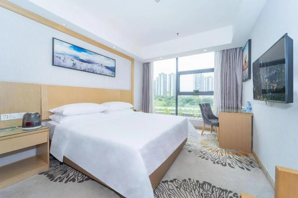 Bed in Vienna Hotel Guangzhou Huadu Financial Center Sunac Amusement Park