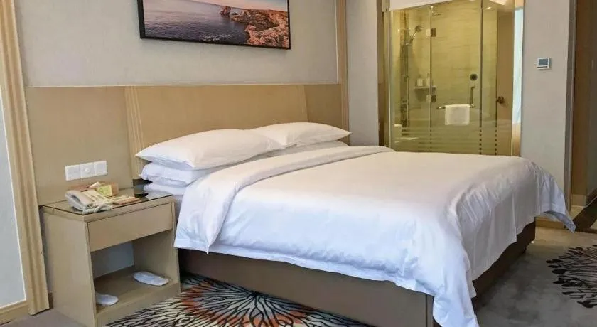 Bed in Vienna Hotel Guangzhou Huadu Financial Center Sunac Amusement Park