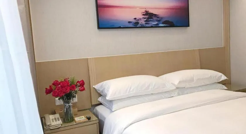 Bed in Vienna Hotel Guangzhou Huadu Financial Center Sunac Amusement Park