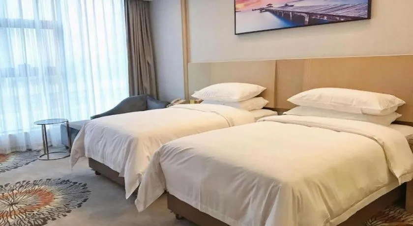 Bed in Vienna Hotel Guangzhou Huadu Financial Center Sunac Amusement Park