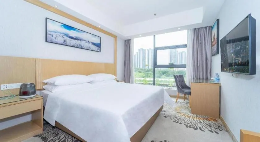 Bed in Vienna Hotel Guangzhou Huadu Financial Center Sunac Amusement Park