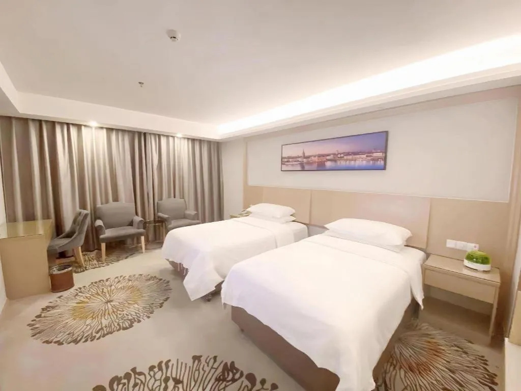 Bed in Vienna Hotel Guangzhou Huadu Financial Center Sunac Amusement Park