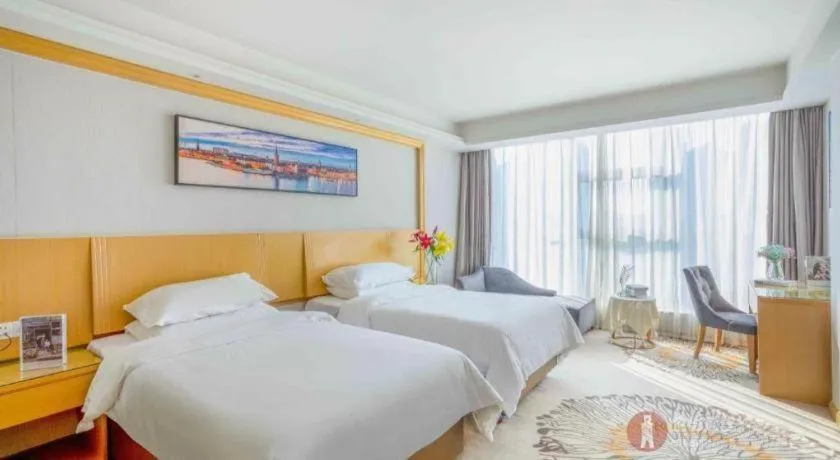 Bed in Vienna Hotel Guangzhou Huadu Financial Center Sunac Amusement Park