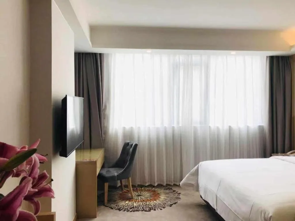 Bed in Vienna Hotel Guangzhou Huadu Financial Center Sunac Amusement Park