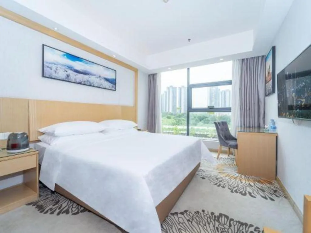 Bed in Vienna Hotel Guangzhou Huadu Financial Center Sunac Amusement Park