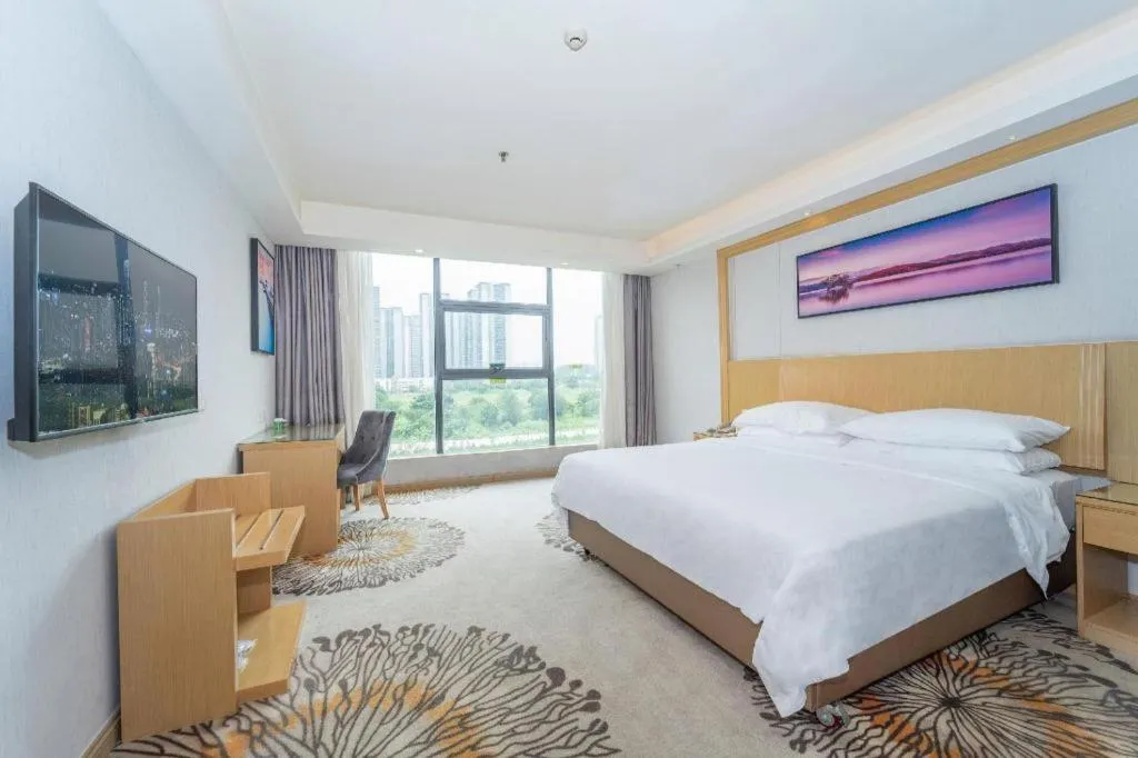 Bed in Vienna Hotel Guangzhou Huadu Financial Center Sunac Amusement Park
