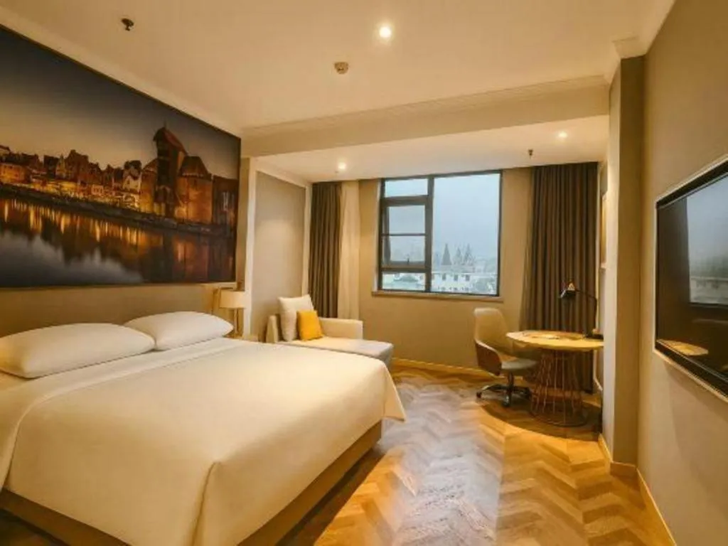 Bed in Vienna Hotel Jiangsu Dongtai Wanghai West Road