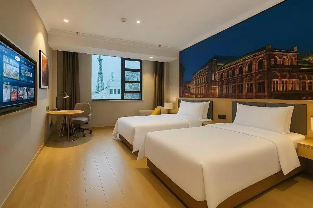 Bed in Vienna Hotel Jiangsu Dongtai Wanghai West Road
