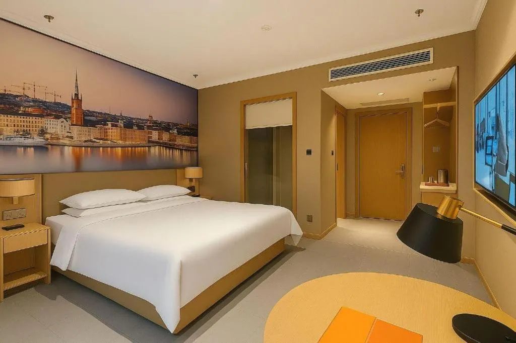 Bed in Vienna Hotel Jiangsu Dongtai Wanghai West Road