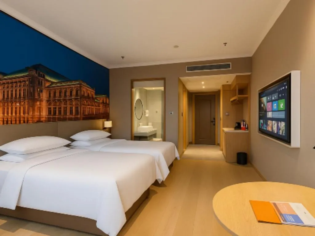 Bed in Vienna Hotel Jiangsu Dongtai Wanghai West Road